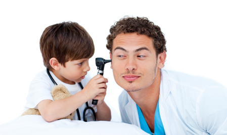 Concentrated little boy playing with the doctor